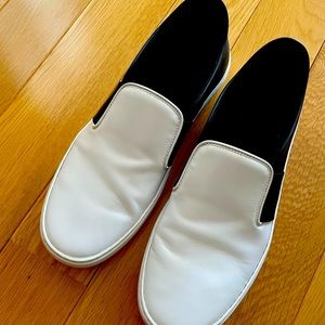 Chanel black and white slip ons
